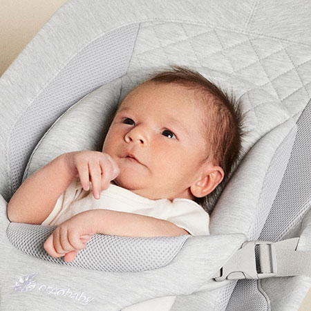 Newborn photo showing head position in evolve bouncer